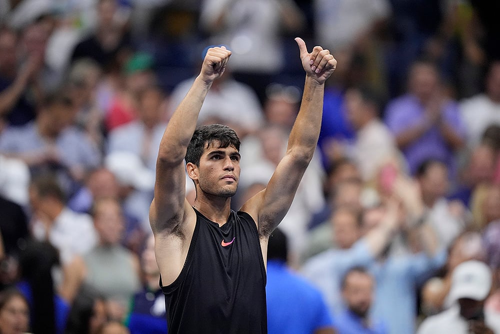| Photo: AP/Matt Rourke : US Open 2024: Carlos Alcaraz of Spain, reacts after defeating Li Tu, of Australia